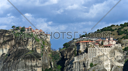 Panoramic view of the Orthodox Varlaam Monastery in Meteora, Greece on high mountain rock and blue sky