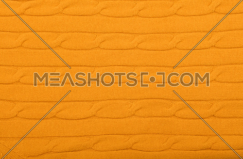 Close up background of vivid yellow knitted wool jersey fabric texture