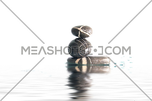 wet zen stones on a white background