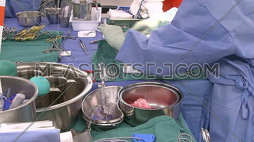 Medium shot for Surgical tray and Surgical technician checking equipment 