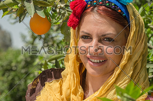 a portrait of an egyptian female farmer wearing traditional clothes